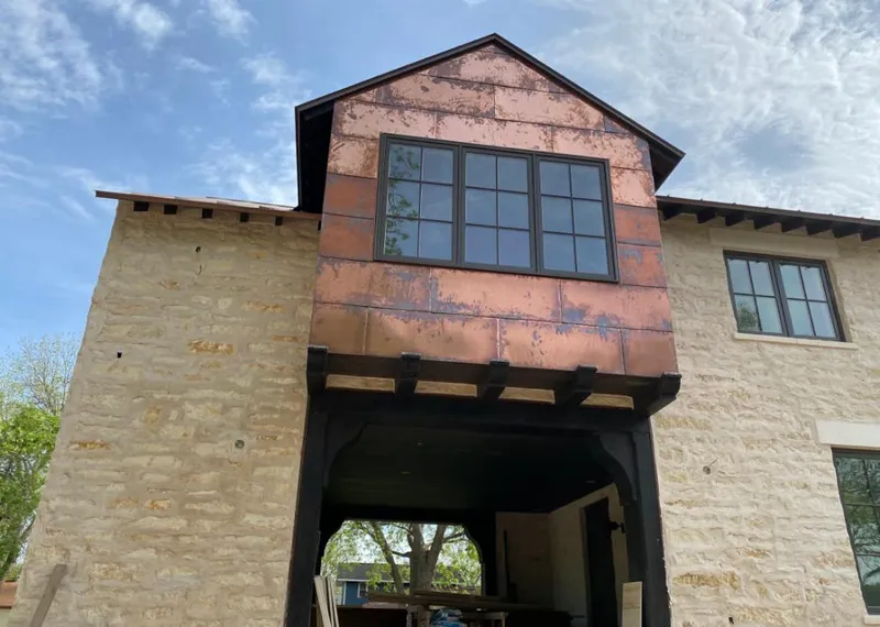Copper metal panel facade on a stone building for Skylight Installation in Beverly Hills