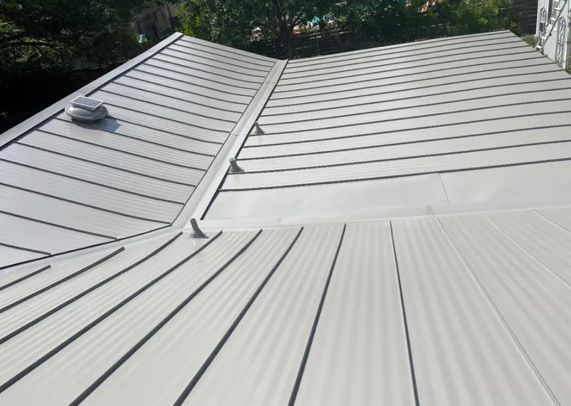 Solar attic fan installed on a metal roof for Roof Ventilation in Beverly Hills